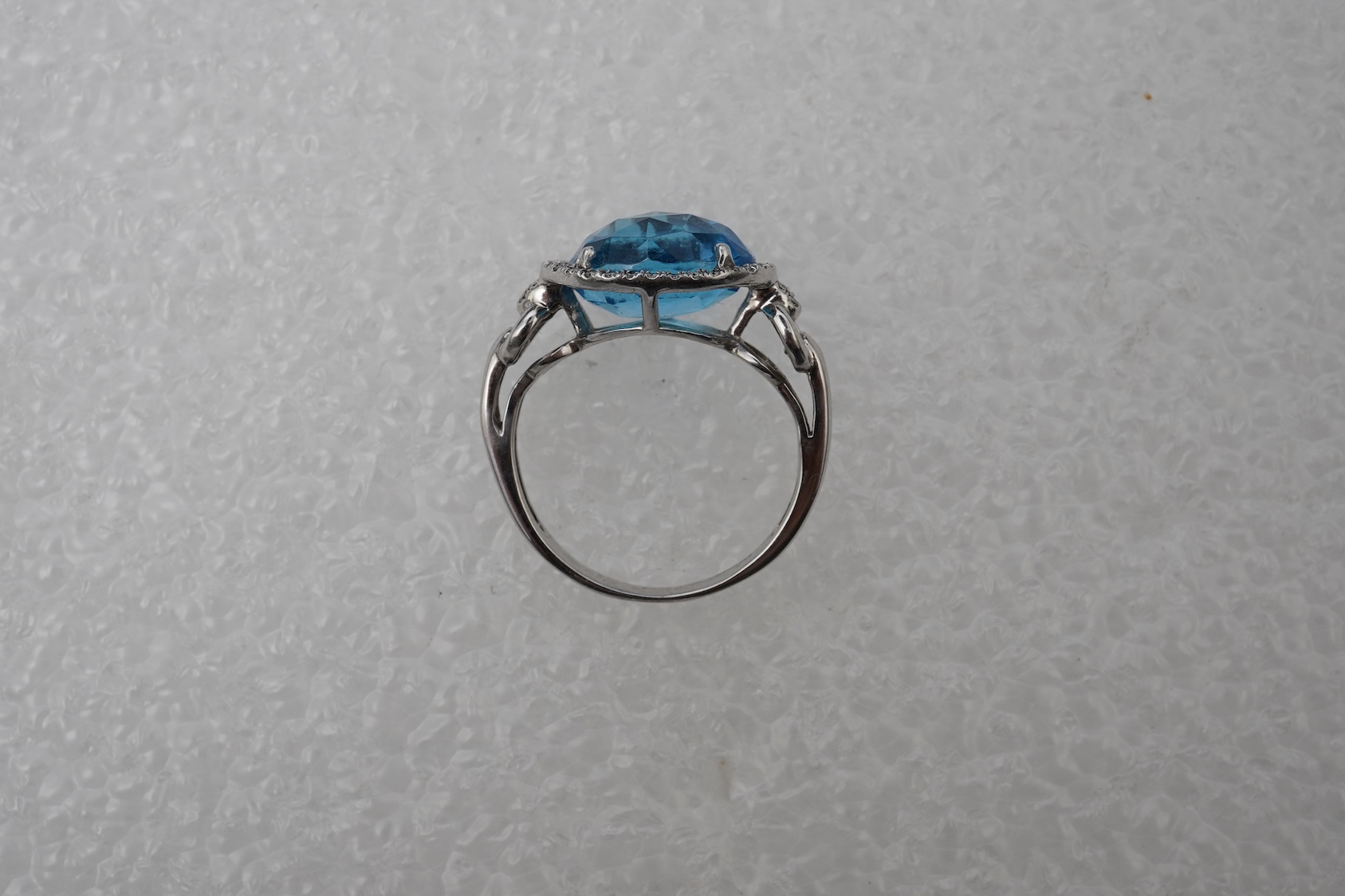 A blue topaz and diamond ring